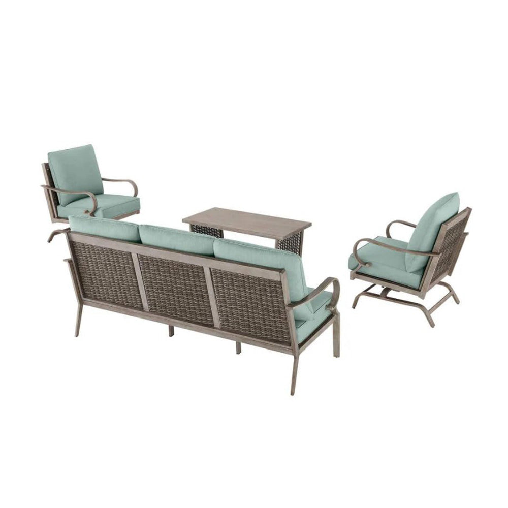 Outdoor furniture set with a sofa, two chairs, and a table on a white background