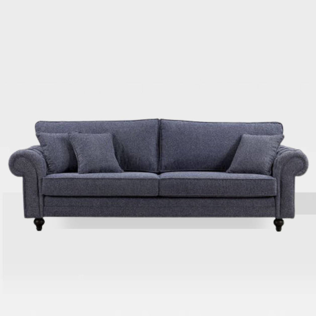 A four-seater blue sofa with cushioned seats and backrest, set against a white background.