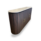 Wavy wooden console table with marble top on a white background