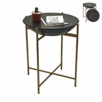 A round dark brown storage side table with brass/gold metal legs, shown with a plant and a book on its top.