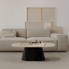 Beige sofa with a coffee table in a minimalistic living room setting