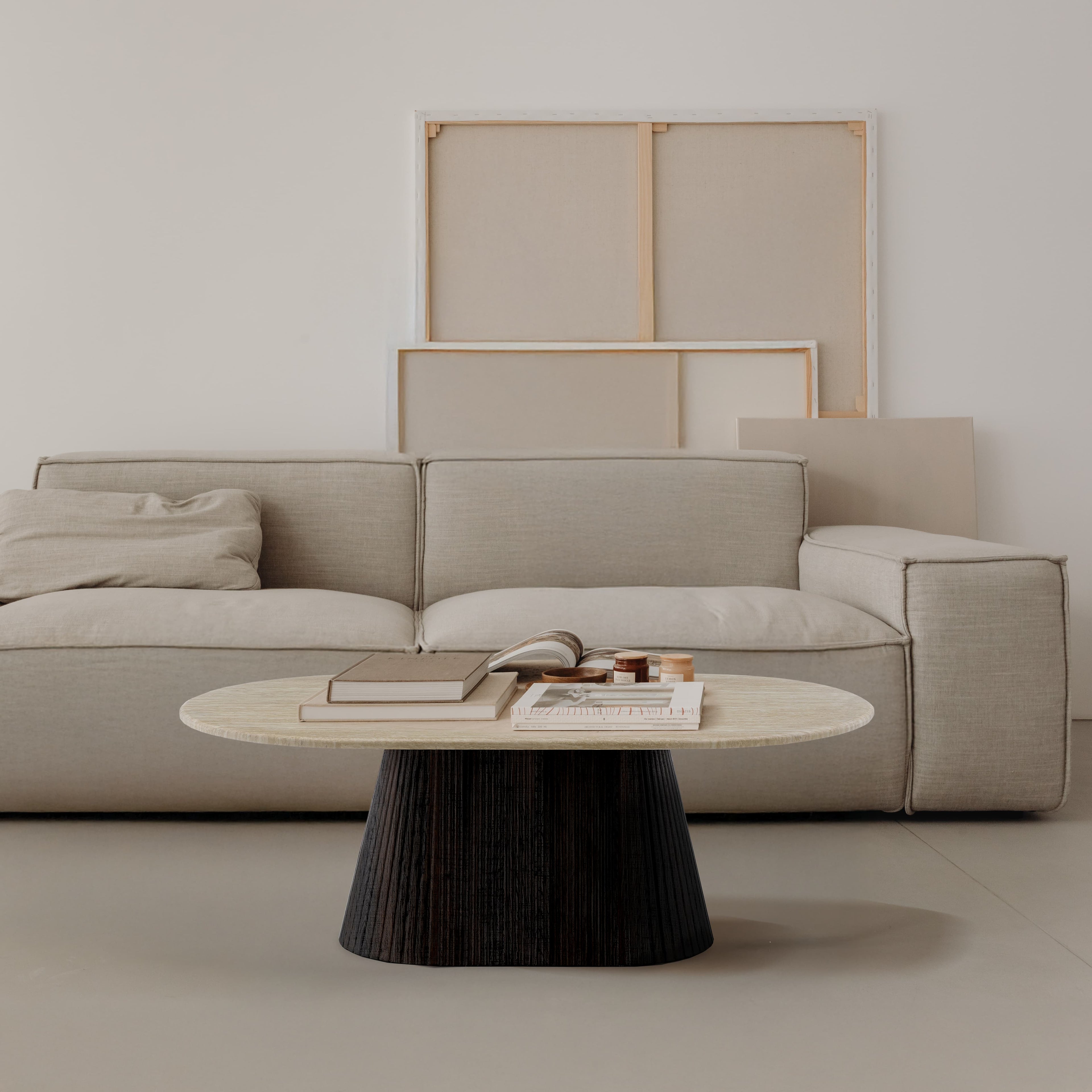 Beige sofa with a coffee table in a minimalistic living room setting