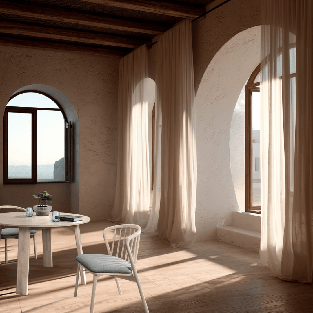 Modern interior with round table and chairs near large windows with curtains.
