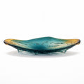 Glass dish with teal and gold gradient on a white background