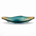Glass dish with teal and gold gradient on a white background