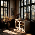 Nestled corner of a room with large windows, a white cabinet, and decorative items.